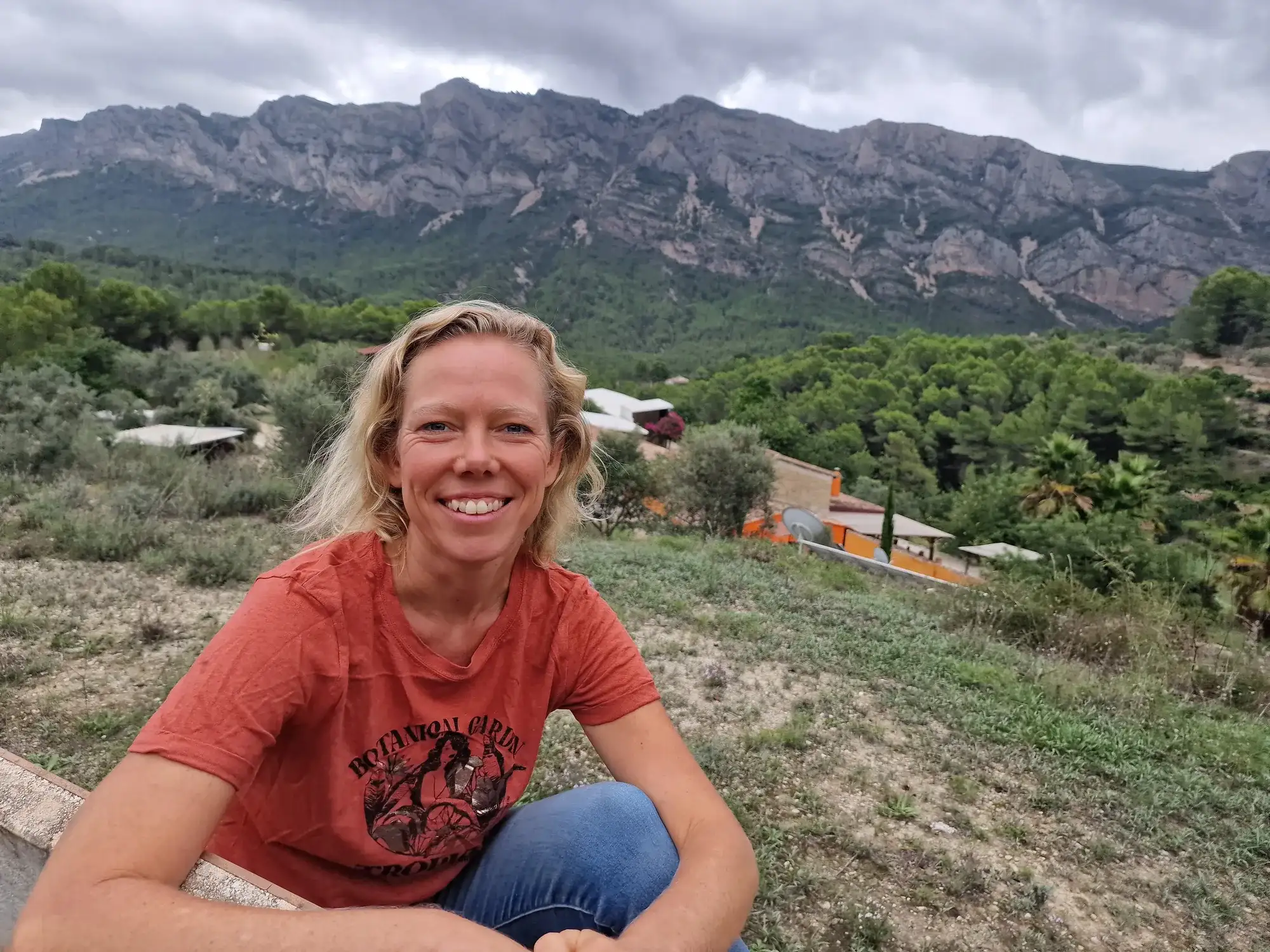 Chantal Bruijsten at the retreat property with the Spanish mountains behind her
